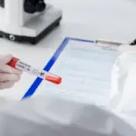 stock-photo-cropped-view-blurred-doctor-positive-covid-omicron-variant-test-writing